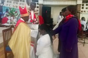 The Bishop of Southern Malawi, confirms 13 young people at St Luke’s Anglican Church in Nkolokoti, Blantyre. He has called for more investment in young people.